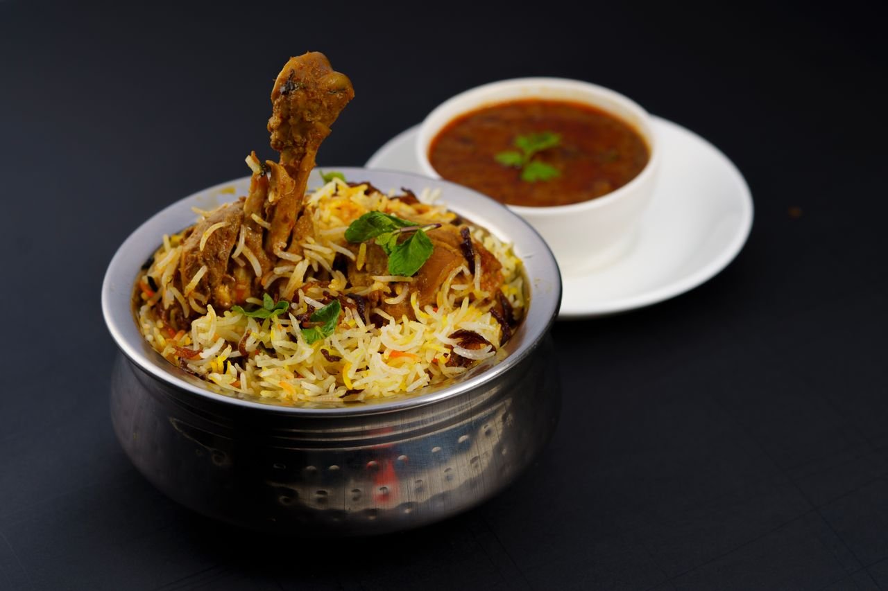 Mastering the First Impression: Your intriguing post title goes here Flavorful chicken biryani served with spicy curry, a traditional Indian dish.